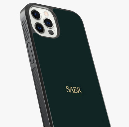 Sabr Minimal Patience Glass Case captured at a warm angle highlighting gloss, texture and premium glass finish.