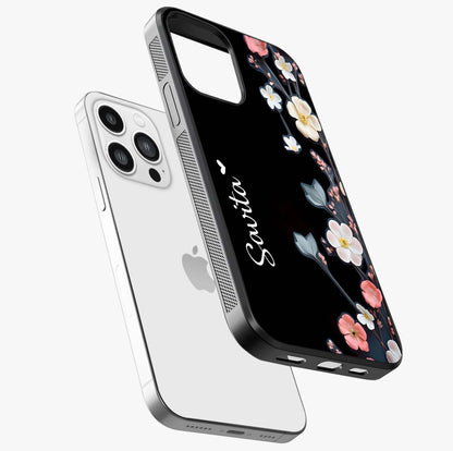 Black Elegance Floral Custom Name Glass Case laid diagonally highlighting side profile, edges and glossy glass shine.