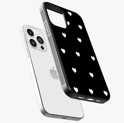 Cute And Simple White Hearts Glass Case laid diagonally highlighting side profile, edges and glossy glass shine.
