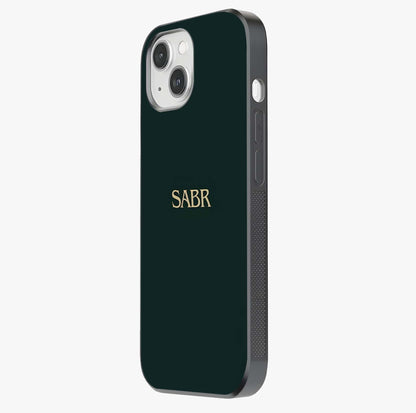 Sabr Minimal Patience Glass Case photographed in natural light showing reflective finish and design depth.