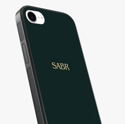 Sabr Minimal Patience Glass Case captured at a warm angle highlighting gloss, texture and premium glass finish.