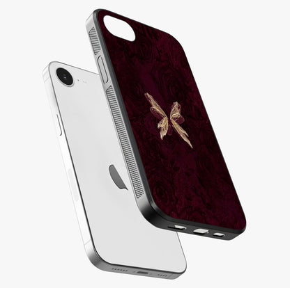 Crimson Fade Butterfly Glass Case laid diagonally highlighting side profile, edges and glossy glass shine.