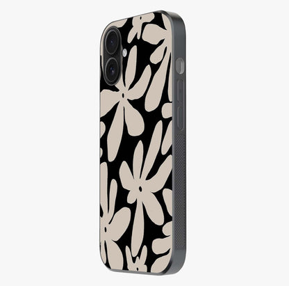 Monochrome Petal Dance Glass Case photographed in natural light showing reflective finish and design depth.