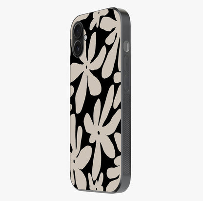 Monochrome Petal Dance Glass Case photographed in natural light showing reflective finish and design depth.