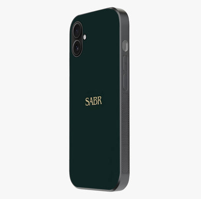 Sabr Minimal Patience Glass Case photographed in natural light showing reflective finish and design depth.