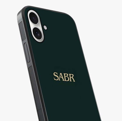 Sabr Minimal Patience Glass Case captured at a warm angle highlighting gloss, texture and premium glass finish.