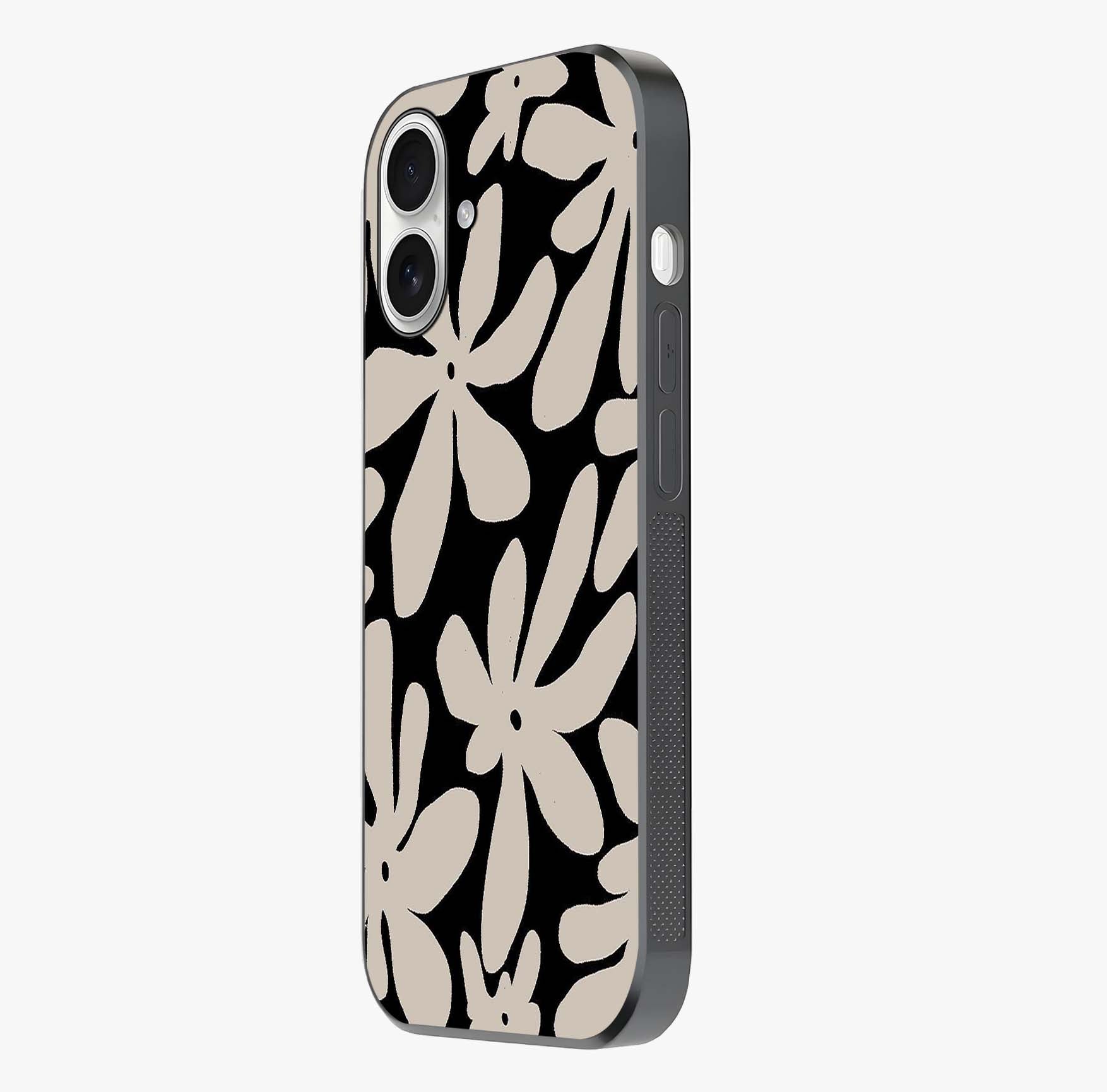 Monochrome Petal Dance Glass Case photographed in natural light showing reflective finish and design depth.