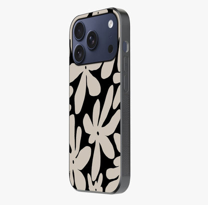 Monochrome Petal Dance Glass Case photographed in natural light showing reflective finish and design depth.