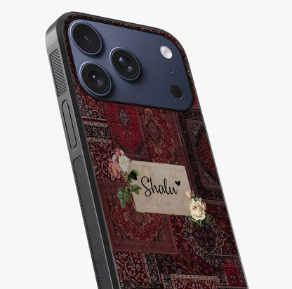 Velvet Wine Pattern Custom Name Glass Case captured at a warm angle highlighting gloss, texture and premium glass finish.