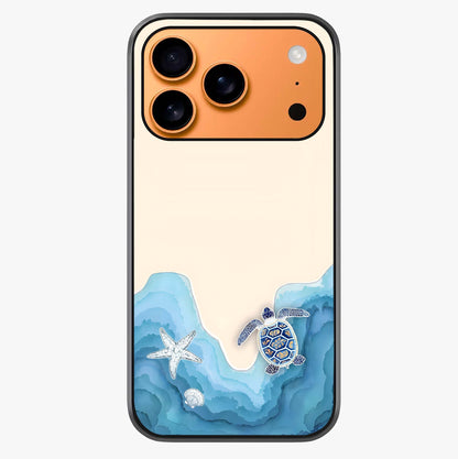 Ocean Drift Turtle Glass Case captured at a warm angle highlighting gloss, texture and premium glass finish.