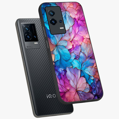 Radiant Floral Whirl Glass Case displayed in angled mockup highlighting vibrant flower pattern with dynamic artistic aesthetic.