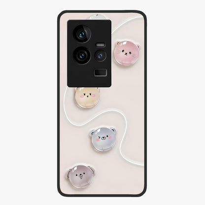 Puffy Face Parade Glass Case showing flat back view with cute puffy character faces artwork and glossy glass finish.