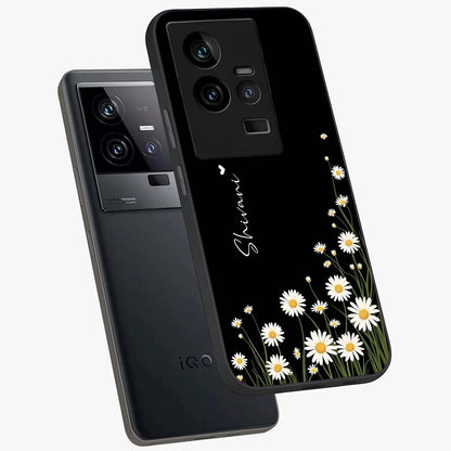 Daisy Cascade Custom Name Glass Case displayed in angled mockup highlighting delicate daisy artwork with custom name feature.