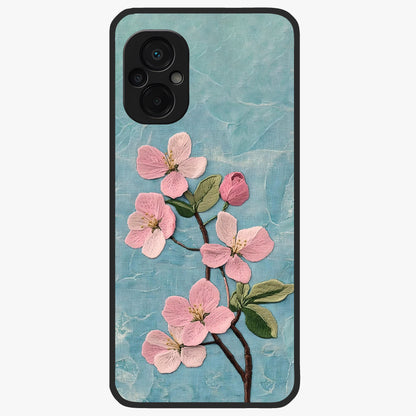 Threaded Blossom Breeze Glass Case showing flat back view with delicate blossom artwork and glossy glass finish.