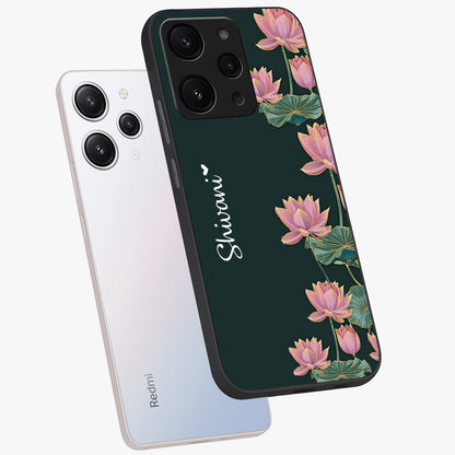 Lotus Bloom Serenity Custom Name Glass Case displayed in angled mockup highlighting graceful lotus illustration with custom name feature.