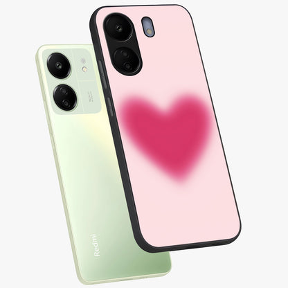 Pink Aura Heart Glass Case displayed in angled mockup highlighting vibrant pink heart design with dreamy aura aesthetic.