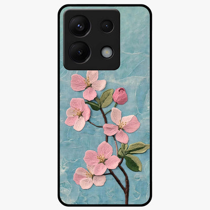 Threaded Blossom Breeze Glass Case showing flat back view with delicate blossom artwork and glossy glass finish.