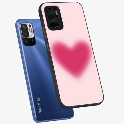 Pink Aura Heart Glass Case displayed in angled mockup highlighting vibrant pink heart design with dreamy aura aesthetic.