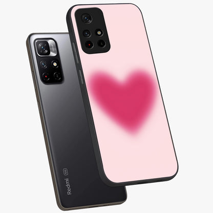 Pink Aura Heart Glass Case displayed in angled mockup highlighting vibrant pink heart design with dreamy aura aesthetic.